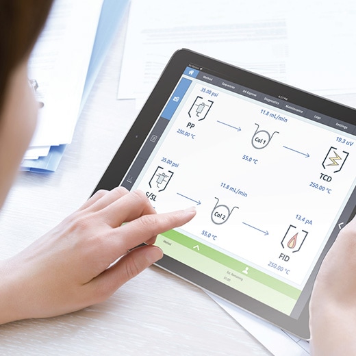 Scientist using tablet displaying instrument interface