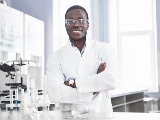 Smiling man in a lab.